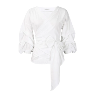 Close-up of white wrap blouse featuring cross V-neck and puff sleeves with bow tie