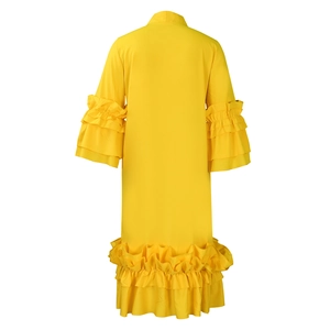 Detail view of bright yellow dress featuring multi-layered ruffle sleeves and layered hem