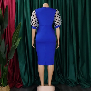Rear view of royal blue pencil dress with polka dot organza puff sleeves and back zipper