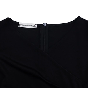 Detail of elegant black V-neckline with high-quality hidden zipper and fine knit fabric