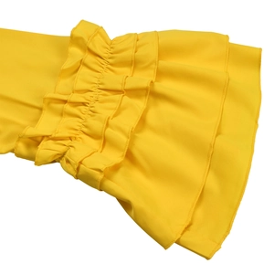 Detailed macro view of bright yellow dress featuring tiered ruffle bell sleeve design
