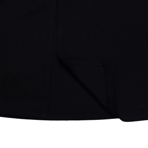 Close-up of black dress hem showing precision double-needle stitching and fabric texture