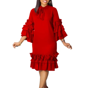 Detail of red tiered ruffle sleeves and elegant bow neckline on a summer dress