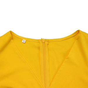 Close-up of yellow puff sleeve pencil dress neckline with invisible back zipper detail