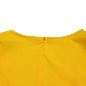 Close-up of invisible zipper and round neckline on bright yellow pencil dress fabric