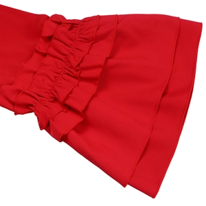 Close-up detail of layered ruffle bell sleeves on a bright red summer fashion dress