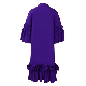 Detail view of deep purple dress back featuring layered ruffle sleeves and flounced hemline