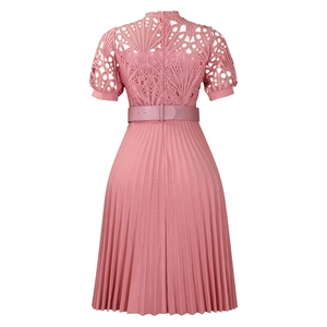 Detail of dusty rose dress featuring intricate lace bodice and pleated skirt with belt