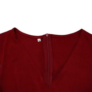 Detail of V-neckline and back zipper on a dark red pencil dress with size M label