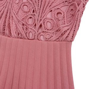 Detail of the intricate lace crochet pattern and pleated fabric on the dusty pink dress