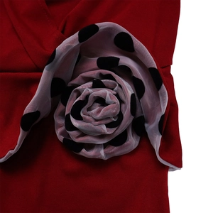Detail of red pencil dress with large 3D polka dot mesh floral applique on sleeve