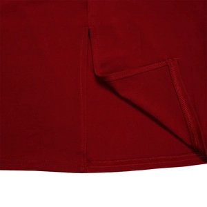 Detailed macro shot of red pencil dress hem showing precise stitching and slit design