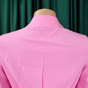 Detail view of pink pleated maxi dress back with elegant lapel collar and shoulder design