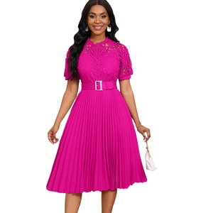 Detail of hot pink lace bodice and high-density pleated skirt with a buckled waist belt