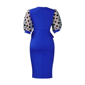Detail of royal blue pencil dress with sheer polka dot puff sleeves and back zipper
