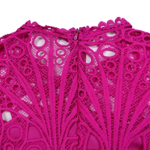 Detail of magenta heavy lace neckline with intricate cutouts and invisible zipper