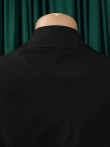 Detailed back view of black pleated dress collar with high-quality tailoring and fine stitching