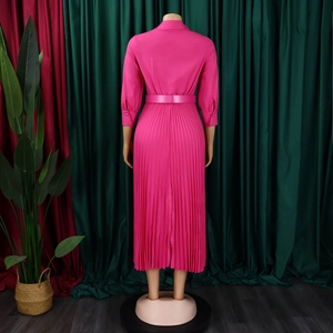 Detail of rose red pleated long sleeve maxi dress with lapel collar and waist belt