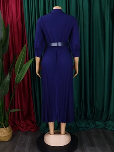 Rear view of pleated royal blue midi dress with waist belt and elegant flared hemline