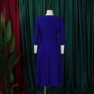 Rear view of royal blue pleated mid-length dress with an invisible zipper closure