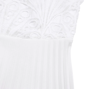 Detail of white dress featuring intricate lace embroidery and vertical pleated fabric