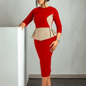 Detail of red and beige bodycon dress featuring elegant peplum waist and 3/4 sleeves