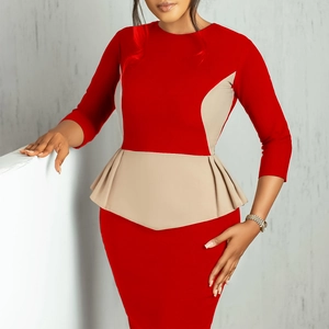 Detail of red color-block dress showing the elegant waist peplum and sleeve texture