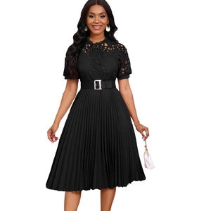 Detail of elegant black dress with floral lace bodice and silver buckled waist belt