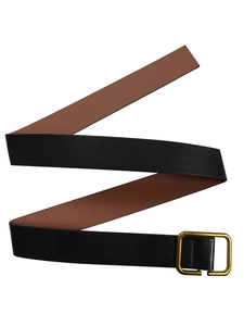 Detail of double-sided leather belt with black exterior, brown interior, and gold buckle