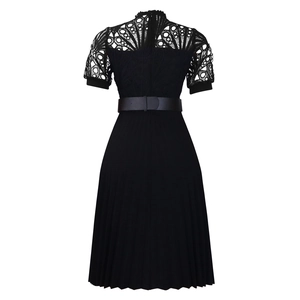 Detail of short sleeve lace splicing and pleated hem on a black African evening dress