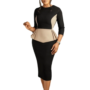 Detail of color-block dress featuring a slimming peplum waist and knee-length pencil cut