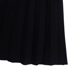 Detailed macro view of the black pleated hem with uniform vertical texture on a blend fabric