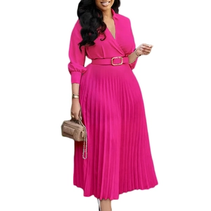 Detail of fuchsia pleated maxi dress with elegant V-neckline and gold buckle waist belt