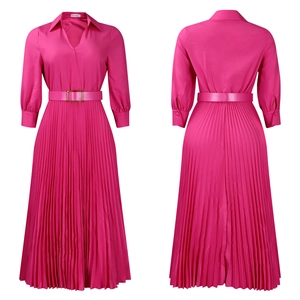 Detailed view of fuchsia pleated maxi dress with lapel collar and golden buckle belt