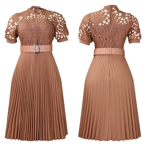 Detailed lace stitching and pleated texture on an elegant earth-tone dress with belt