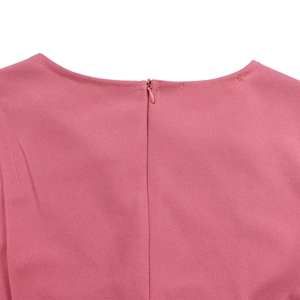 Detail of the back neckline featuring an invisible zipper on a dusty pink pleated dress