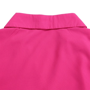 Detail of the elegant fuchsia dress showing the classic lapel collar and clean stitching