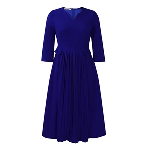 Detail of royal blue dress featuring V-neckline, pleated skirt, and decorative side pockets