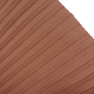 Close-up of brown pleated fabric texture and delicate diagonal ribbed detailing