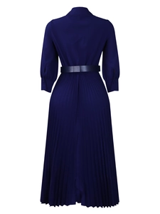 Back view of navy blue pleated long sleeve dress featuring a cinched waist with wide belt