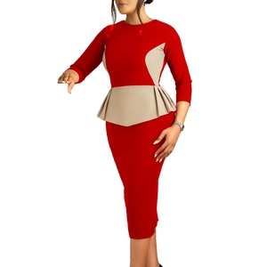 Detail of red and beige color-block dress showing the waist peplum and slim fit design