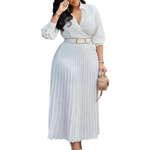 Detail view of the deep V-neck and pleat texture on this elegant white midi dress