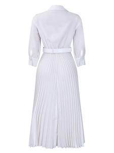 Rear view detail of white pleated long dress with turn-down collar and waist belt