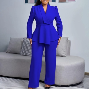Detail of waist-slimming peplum blazer with decorative buttons and matching trousers