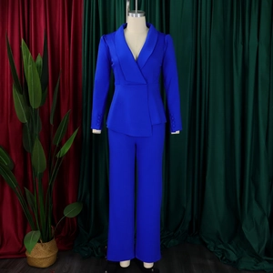 Detail of royal blue blazer set with shawl collar and decorative cuff buttons
