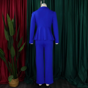 Back view of elegant royal blue pantsuit featuring ruffle waist blazer and matching trousers