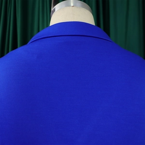 Detail view of royal blue suit jacket stitching and shoulder structure on a mannequin