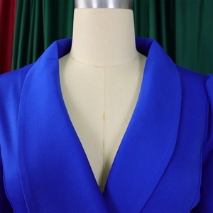 Detailed close-up of royal blue shawl lapel blazer with structured shoulder and textured fabric