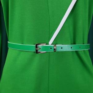 Detail of lime green pencil dress showing matching waist belt and white piping edges