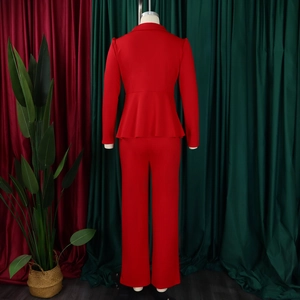 Detail showing the red peplum blazer and matching straight-leg trousers on a mannequin